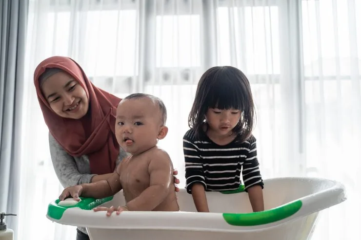 EasyMaid helper caring for a baby at bath time