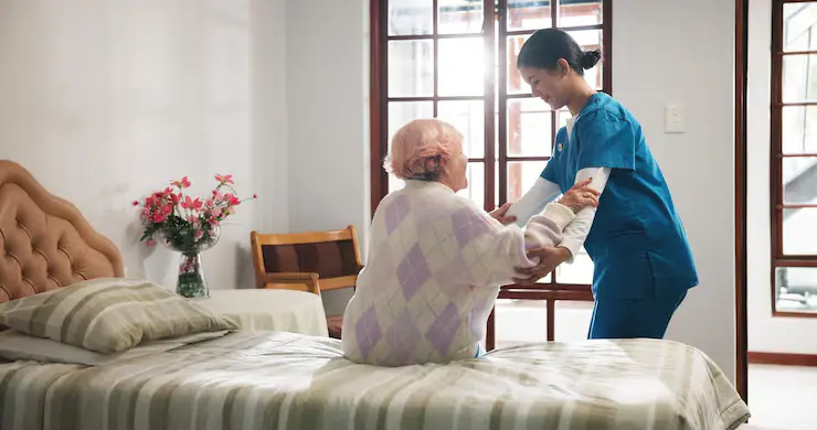 EasyMaid caregiver assisting an elderly patient
